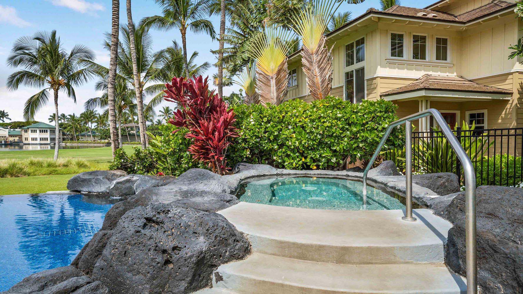 Outdoor hot tub with tropical landscaping