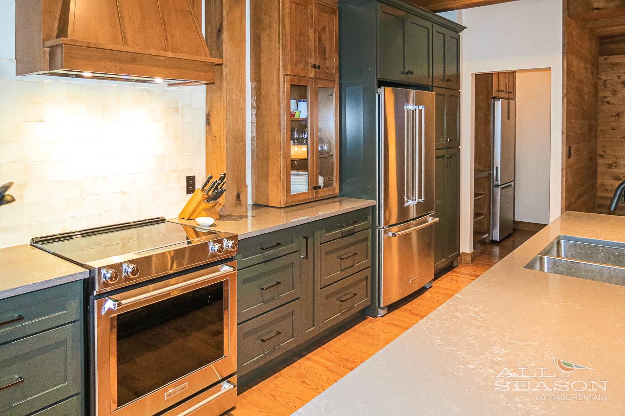 Your spacious kitchen features premium stainless steel appliances, custom cabinetry, and gleaming countertops perfect for preparing memorable meals together.
