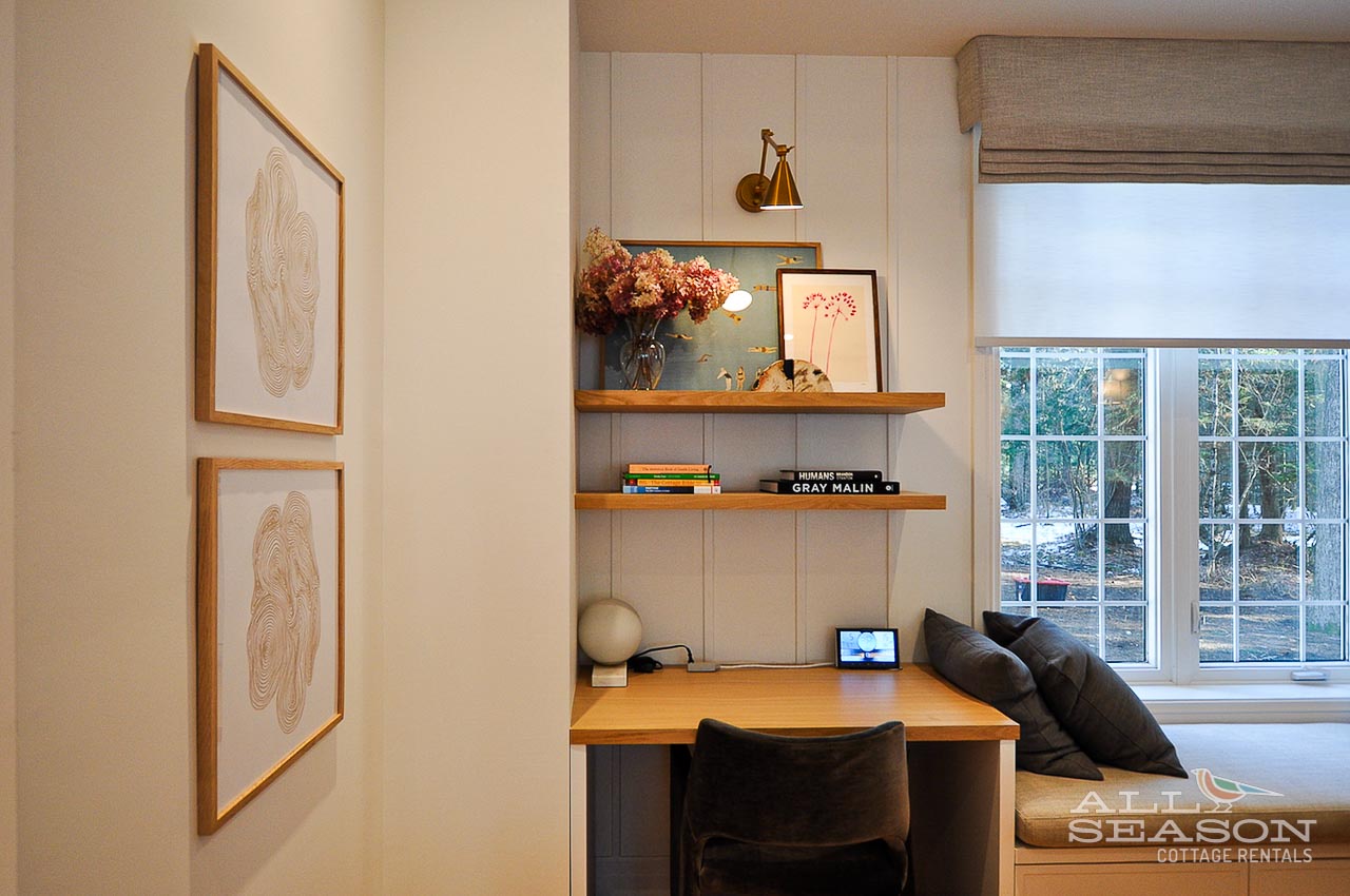 Your dedicated workspace features warm wood shelving and natural light from the garden view—perfect for productive mornings.