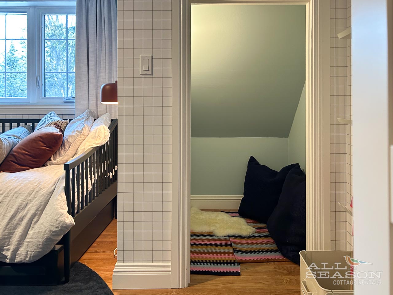 Your bedroom offers a cozy reading nook beneath the sloped ceiling, perfect for unwinding with a book.