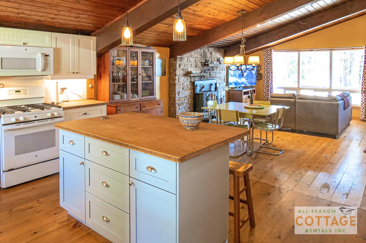 Kitchen island towards dining area and livingroom