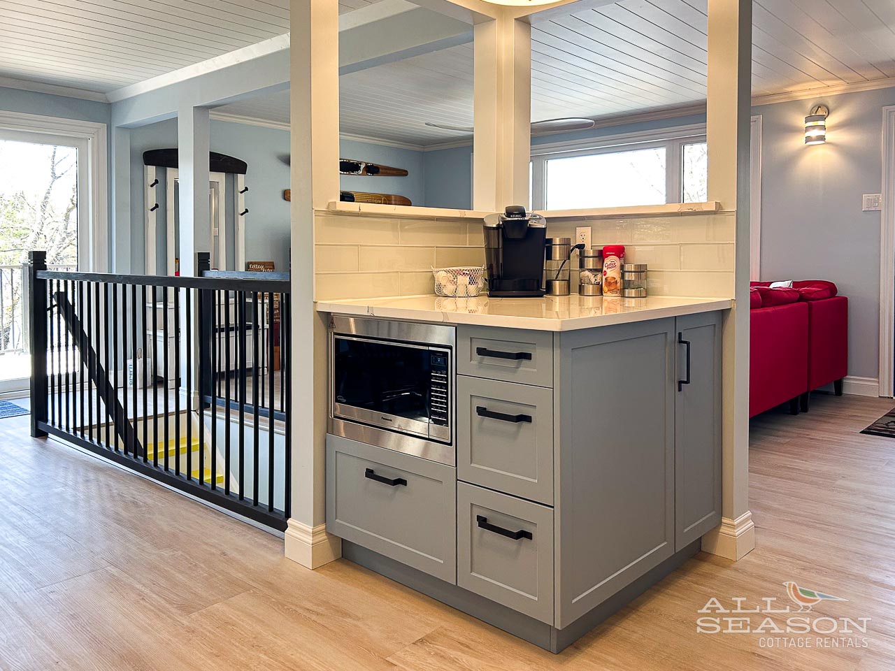 Your open-concept kitchen island offers everything you need for vacation cooking, with modern appliances and a cozy seating area nearby.