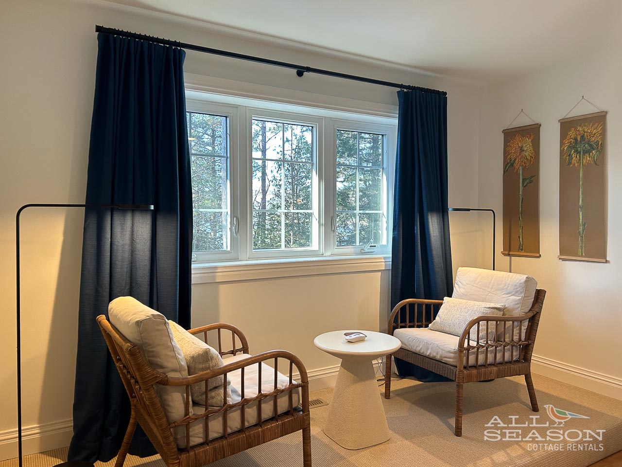 Unwind in your cozy seating nook with bamboo chairs and natural light streaming through garden views.