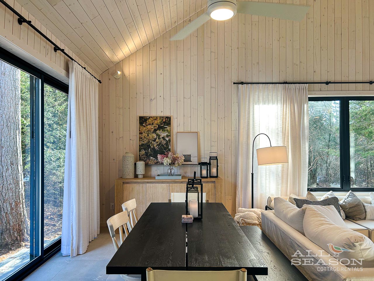 Step into your serene forest retreat with vaulted ceilings and natural wood warmth surrounding you at every turn.