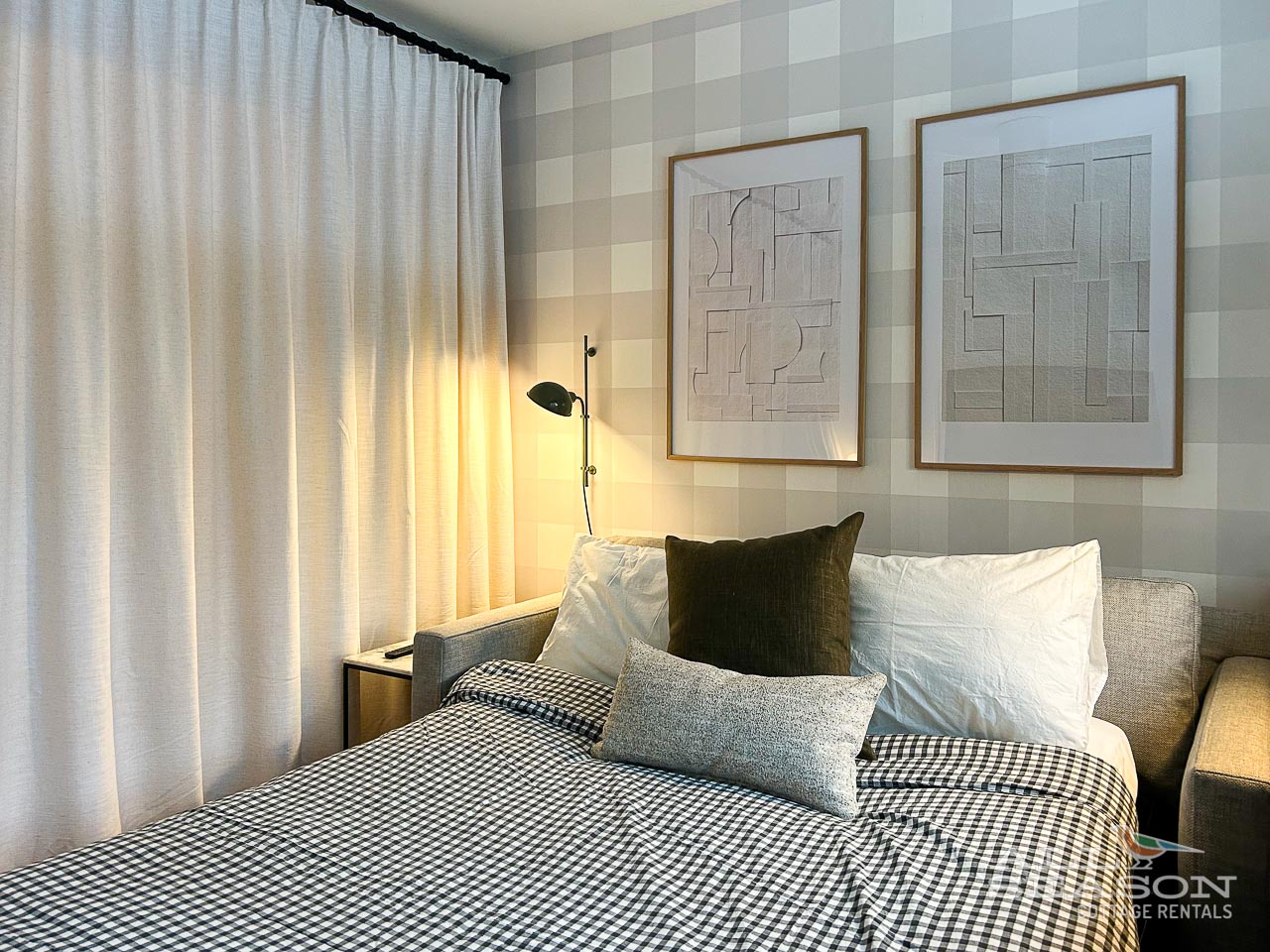 Sink into crisp linens and soft pillows in your peaceful bedroom retreat with modern touches.