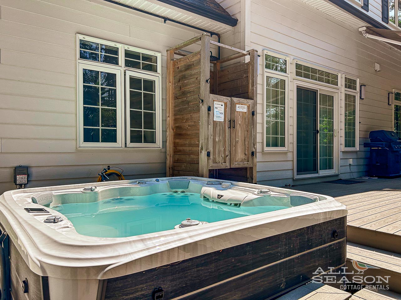 Soak away your stress in your private hot tub on the spacious deck, surrounded by rustic wood privacy screens.