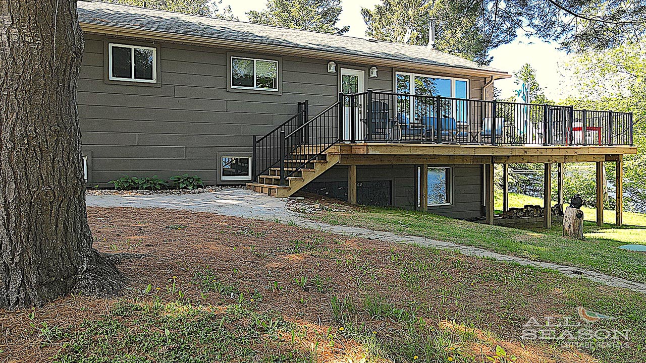 Charming lakeside retreat with spacious deck and private access to nature's tranquility.