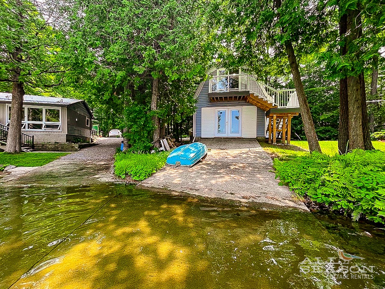 Lakefront property with private dock, boat access, and forested setting offering direct water activities.