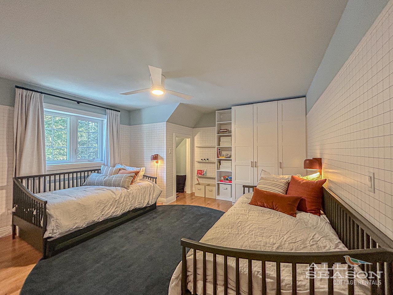 Unwind in your cozy twin bedroom where warm lighting and soft linens create the perfect retreat after your adventures.