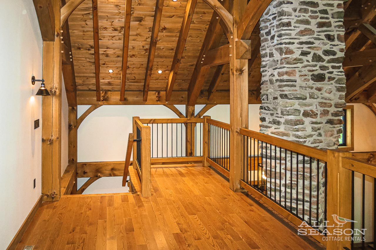 Admire stunning exposed timber beams and rustic stone walls as you explore this beautifully crafted architectural space.