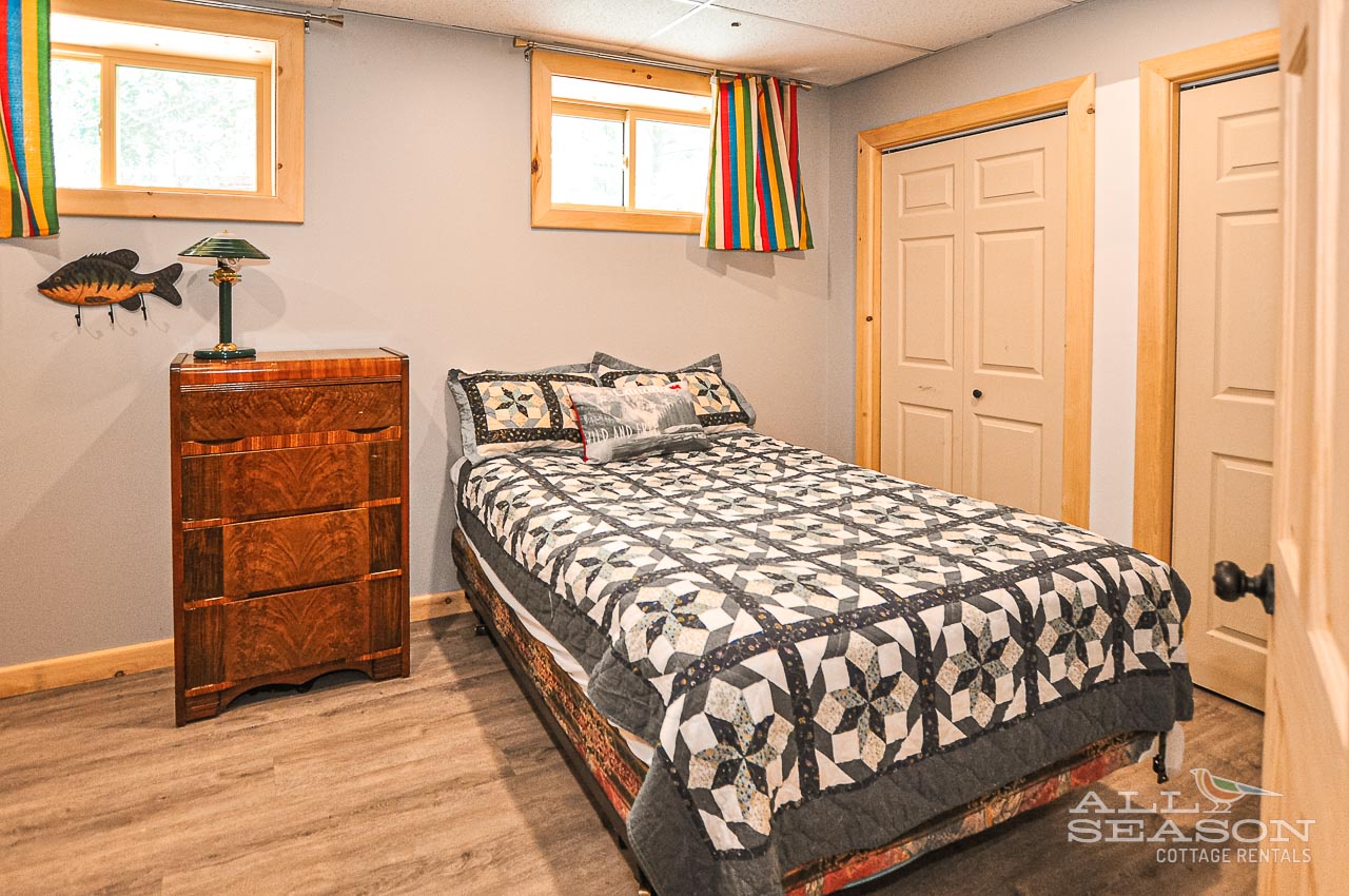 Flagstone_Lower level bedroom with double/single bunk and Queen