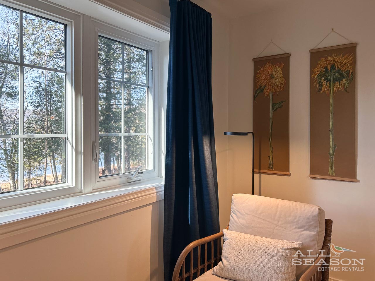 Sink into this cozy chair by the window and watch the seasons change through the trees—your perfect reading nook awaits.