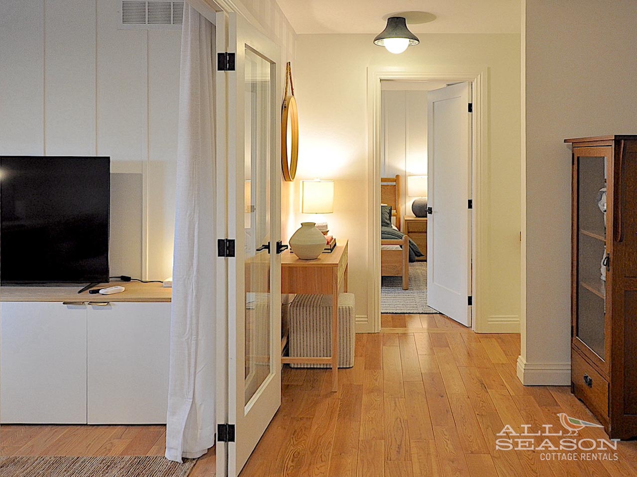 Warm hardwood floors guide you through your elegant suite, where thoughtful design connects your living spaces with natural light and modern comfort.