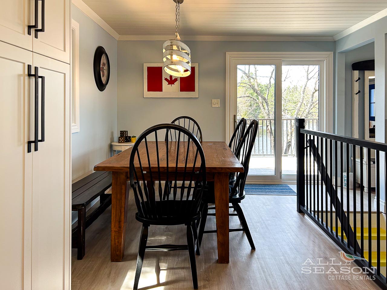 Gather around your private dining table for memorable meals, with natural light streaming through patio doors and cozy Canadian charm throughout.