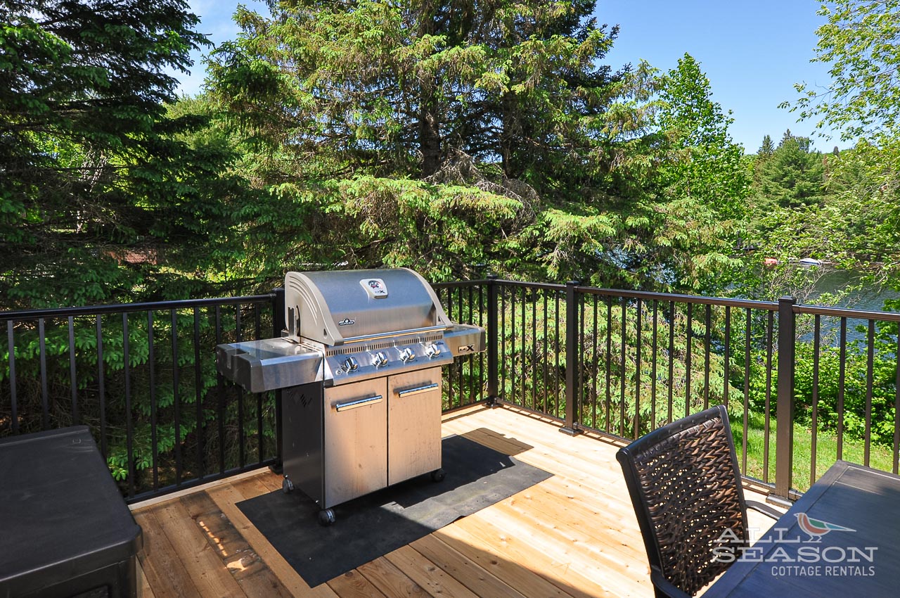 Fire up the grill on your private deck surrounded by lush forest views for memorable outdoor cooking experiences.