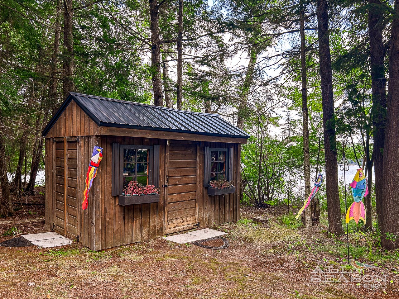 Dockside-Drift-Shed with beach toys, paddles, safety equippment