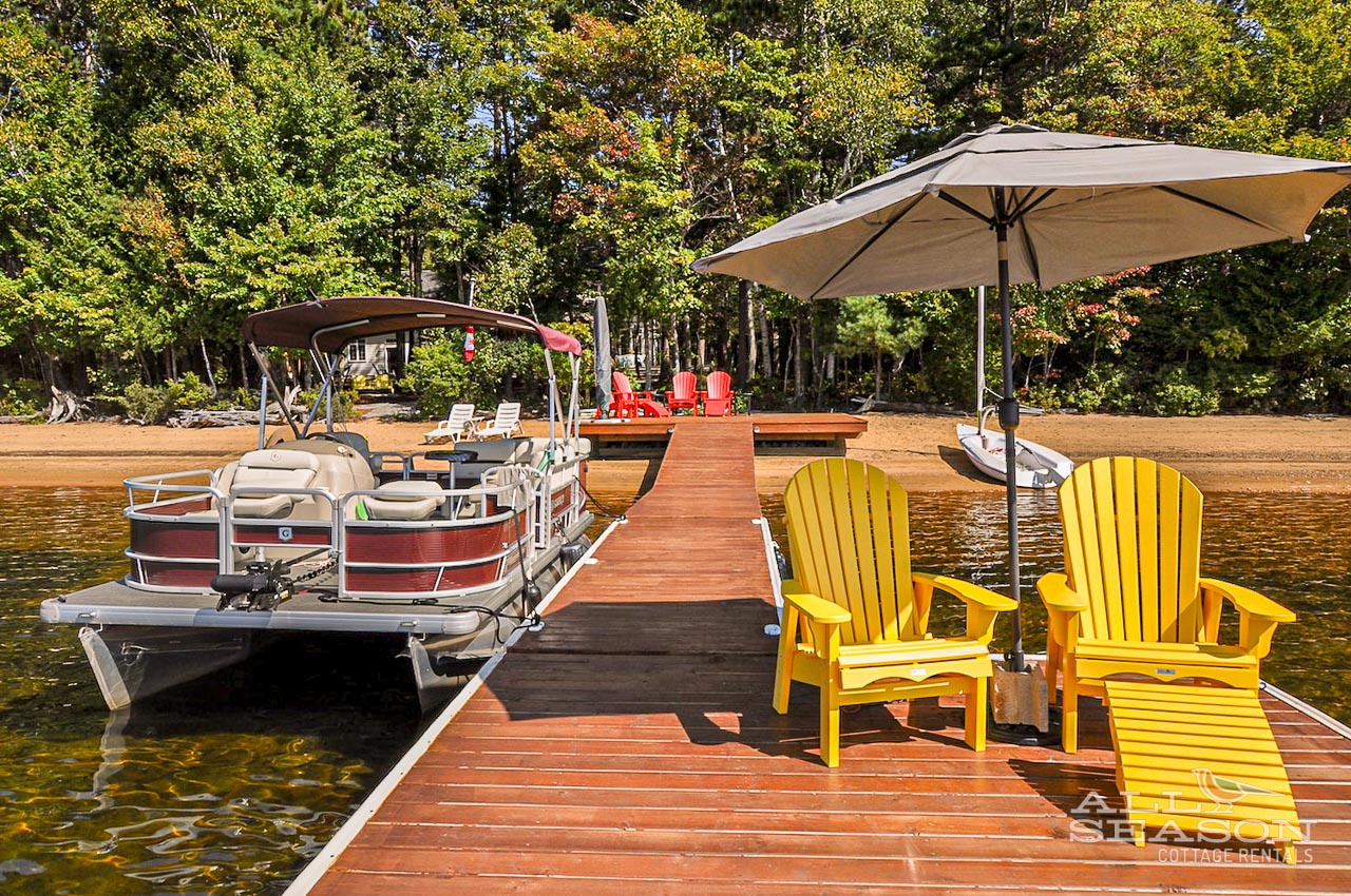 Relax in bright yellow Adirondack chairs on your private dock, where sunshine and lake breezes create the perfect retreat for morning coffee.