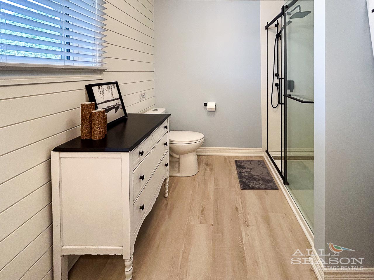 Refresh in your stylish bathroom featuring modern fixtures, elegant design, and a spacious glass shower for your comfort.