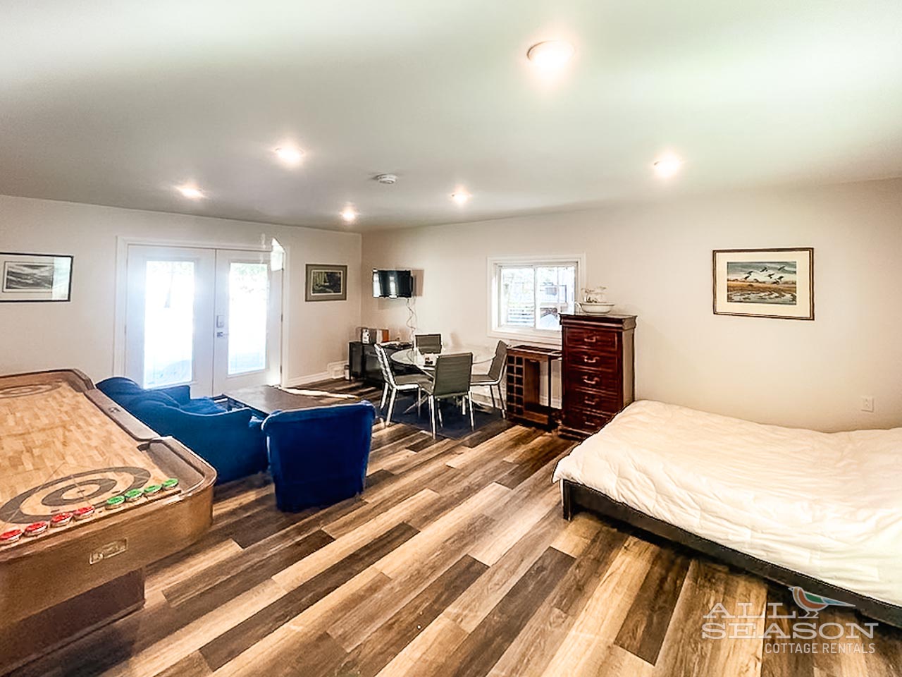 Your spacious suite combines comfort and fun with a cozy bed, plush seating, dining table, and shuffleboard for entertaining evenings together.
