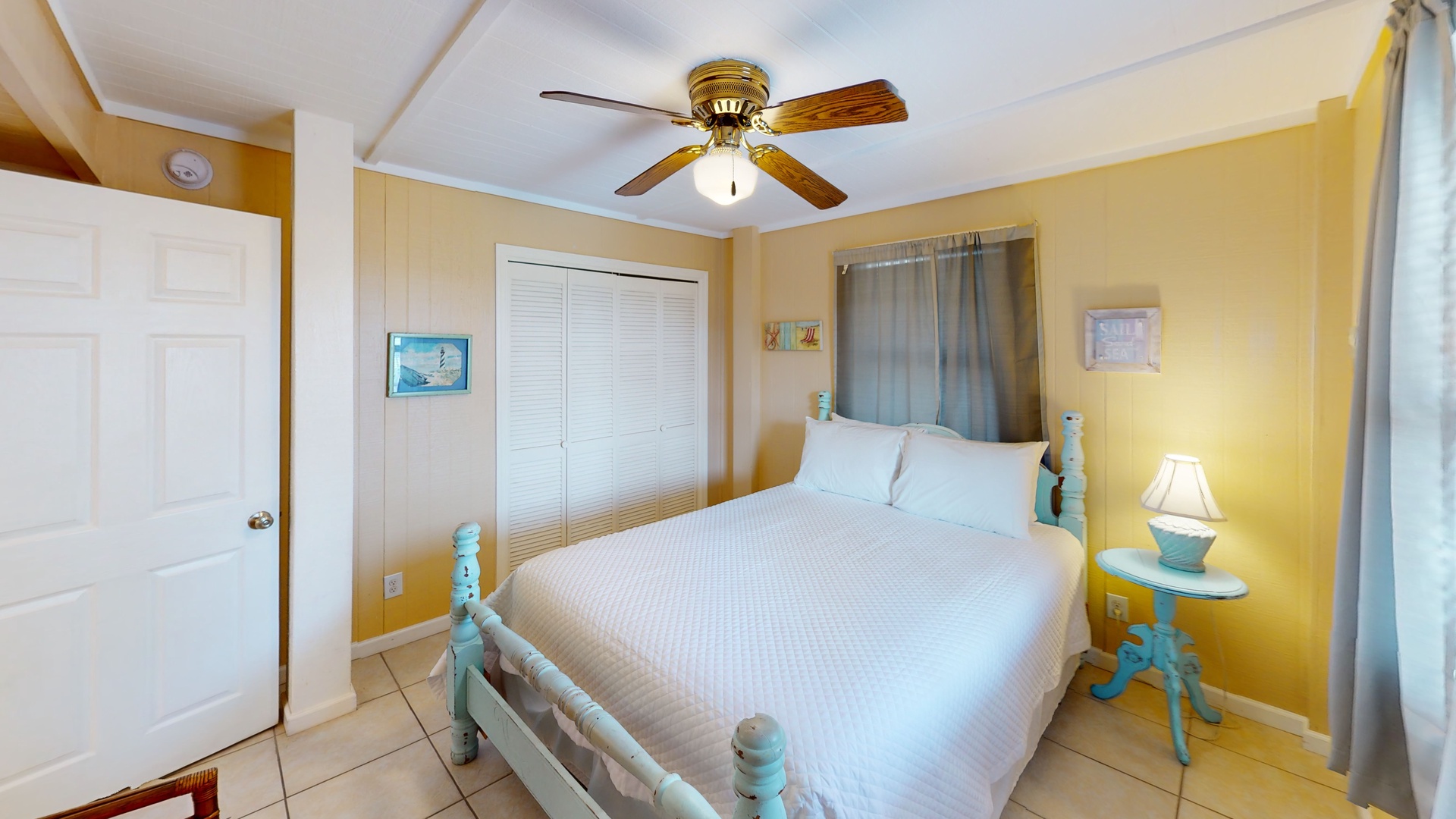 1st floor, bedroom #5 has a queen bed and a ceiling fan