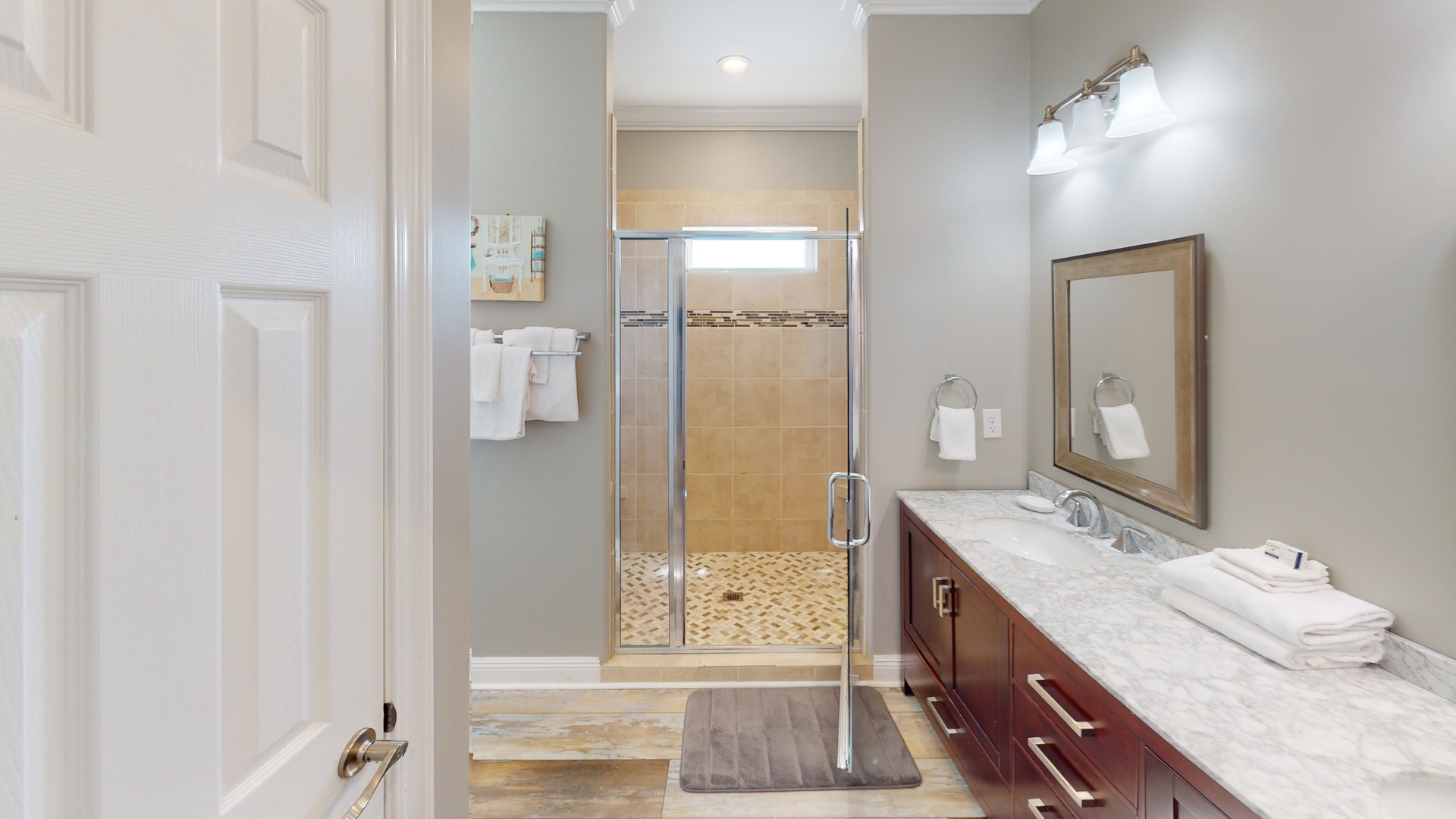 The private in the 2nd master features a double vanity, walk-in shower and a soaking tub