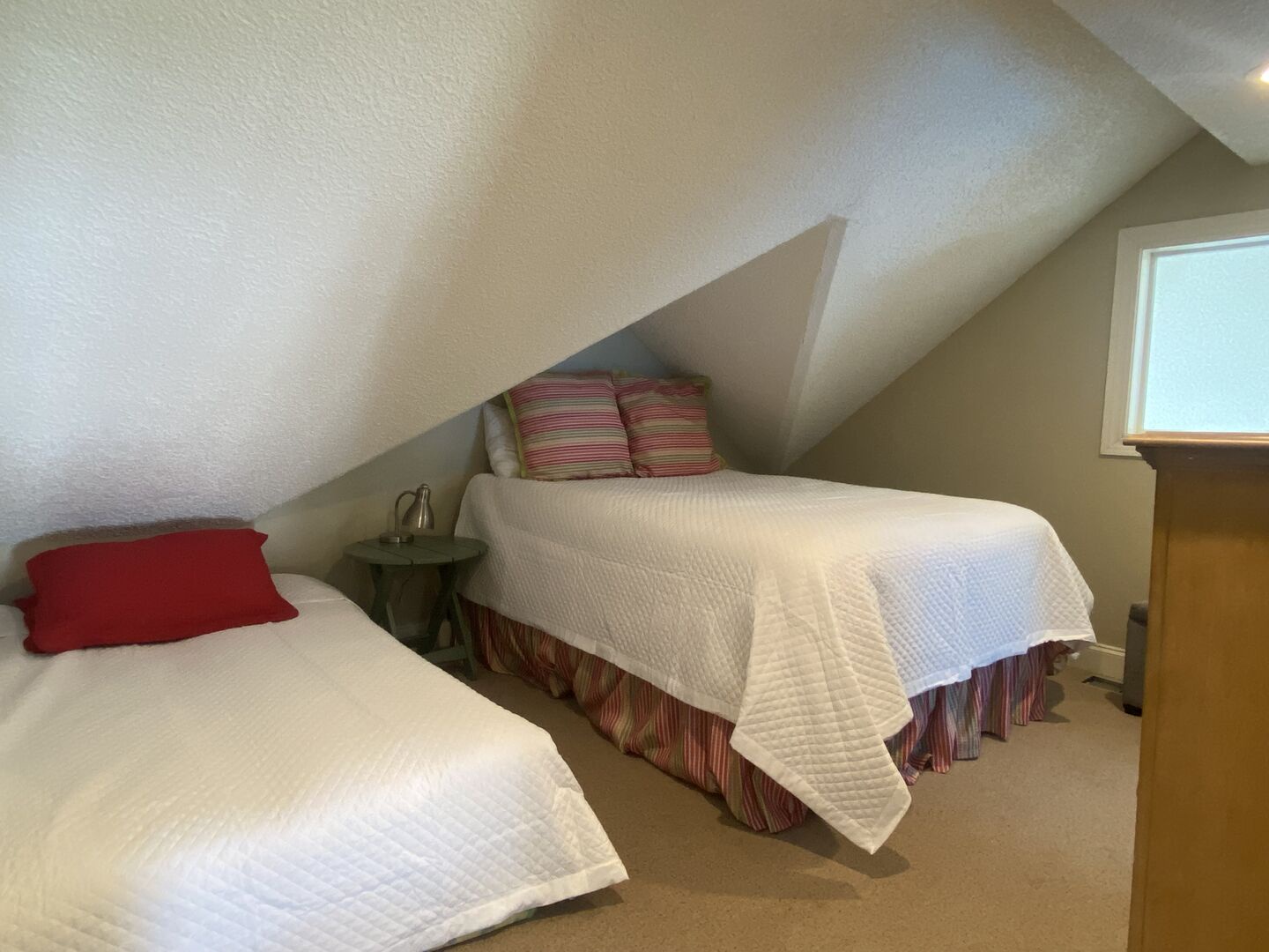 The Loft has a queen bed, twin bed and a private bathroom