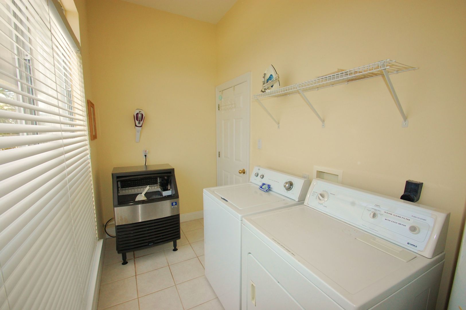 Large laundry room with dedicated ice maker