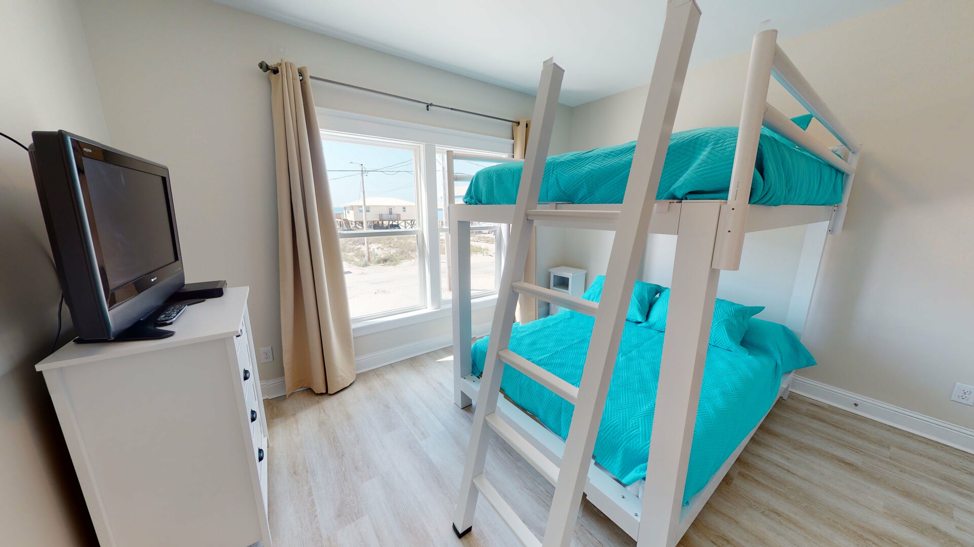 Bedroom 3 features 2 queen bunk beds, TV with cable and gulf views