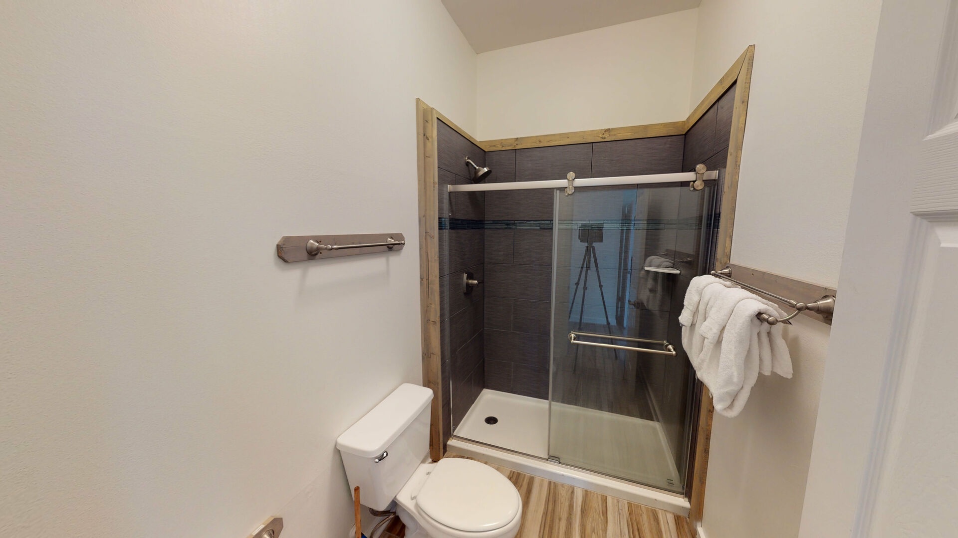 There is a walk-in shower in the bathroom for bedroom #3