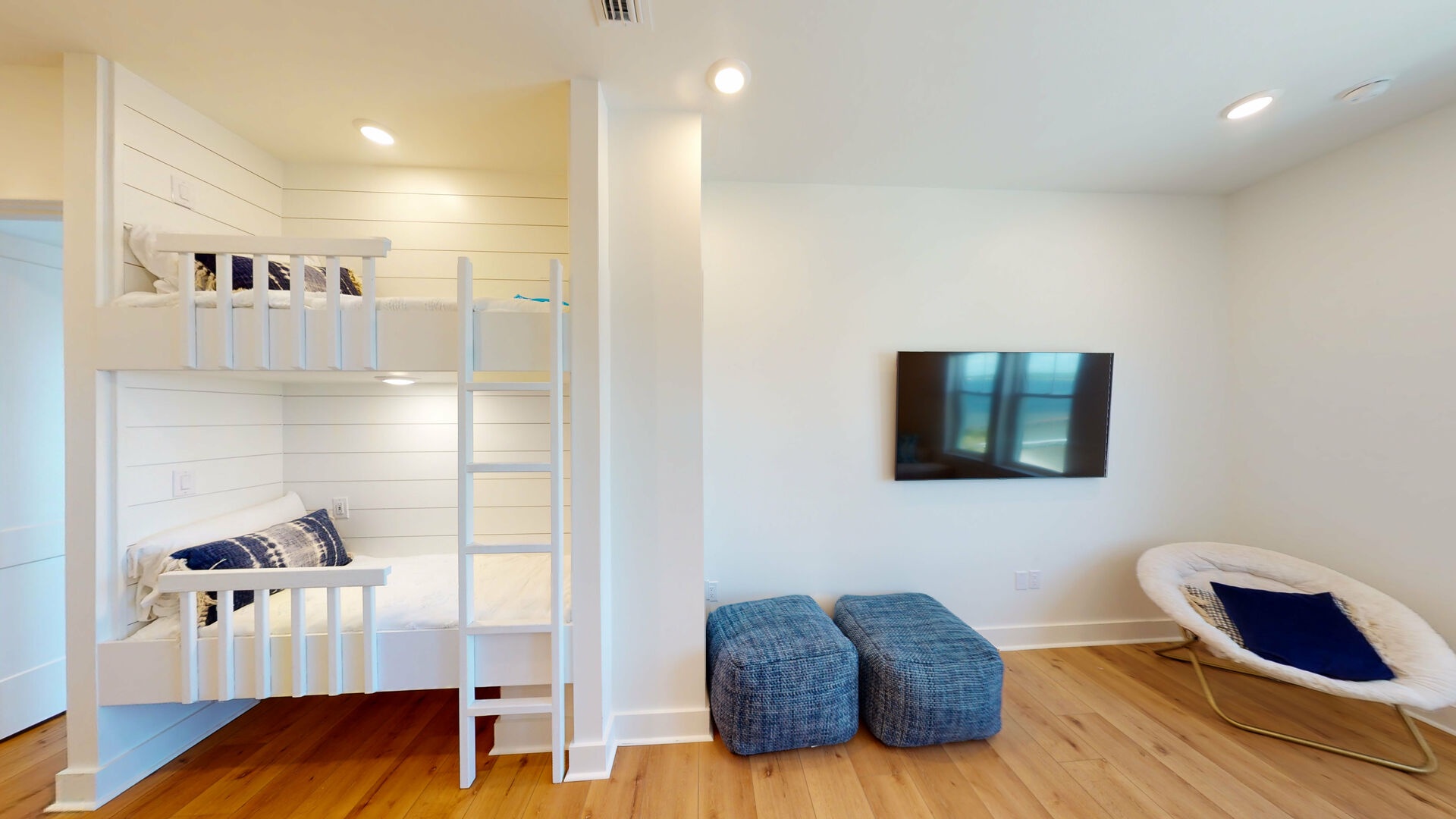 There are 2 twin built-in bunks and a half bath located in the open 2nd floor living area