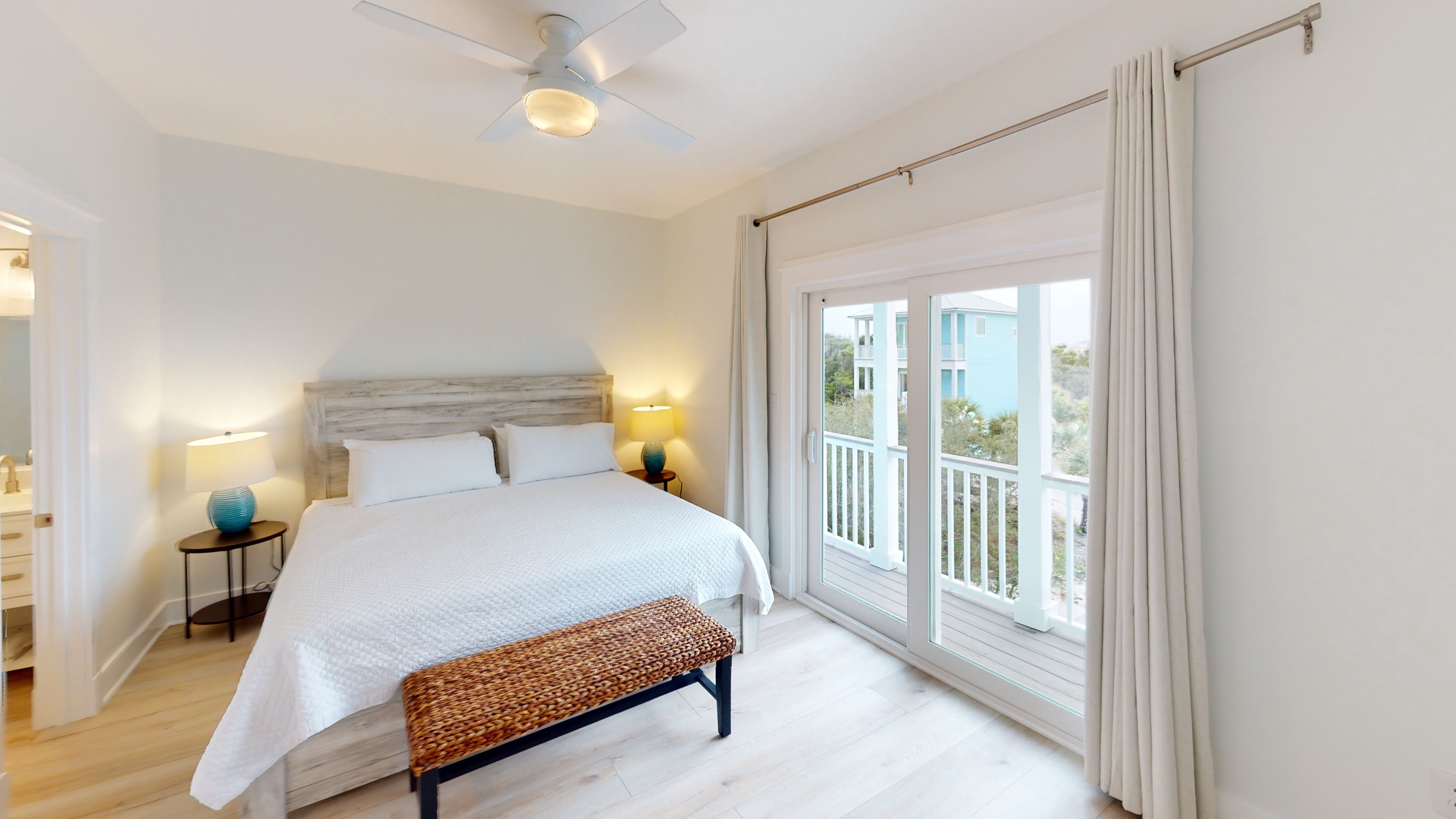 Big Blue-Bedroom 6 is on the 3rd floor with a king bed, balcony access, ceiling fan, TV and a private bathroom