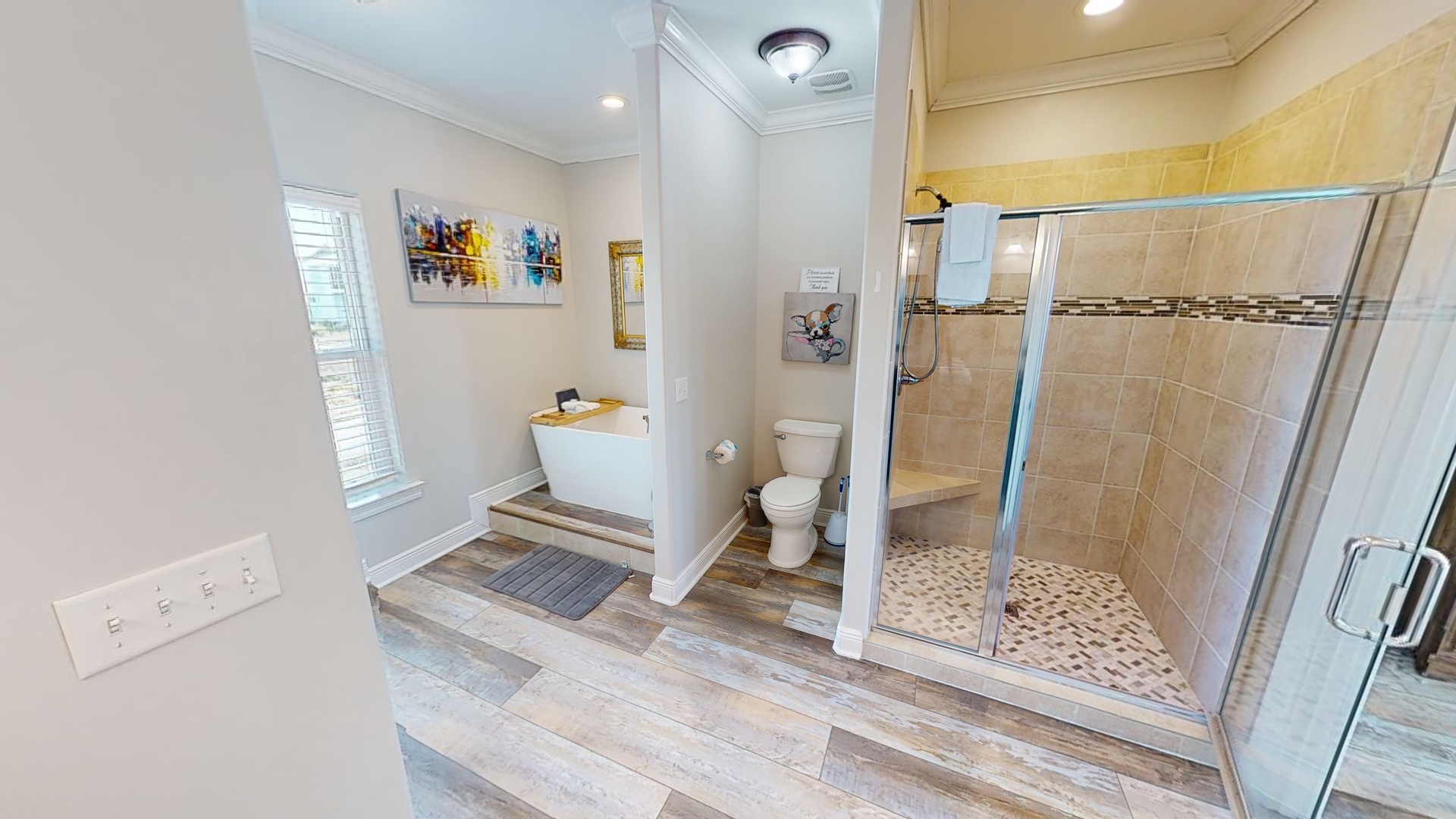 The private master bathroom features a walk-in shower and a soaking tub