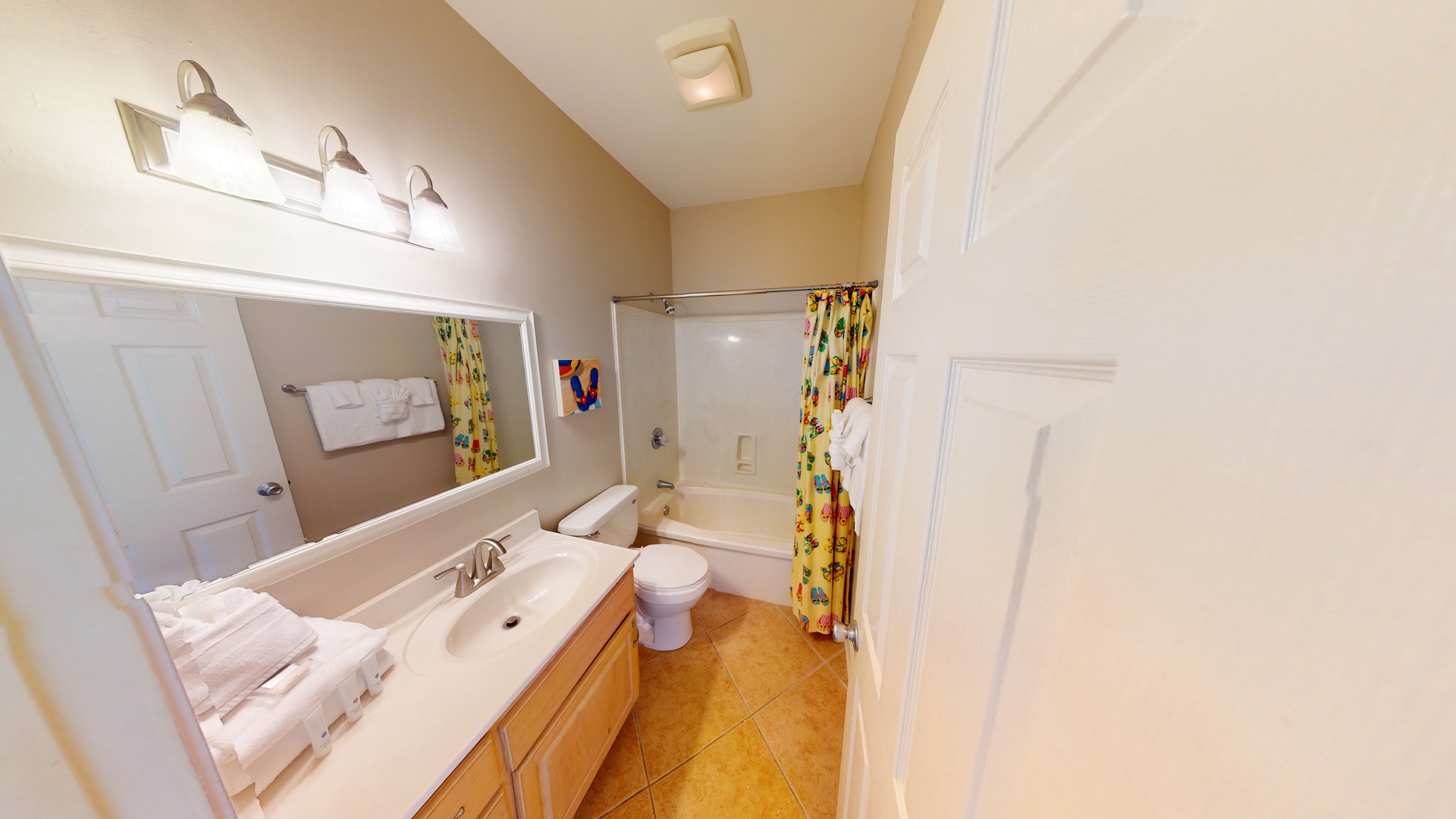 1st floor shared hall bathroom with a tub/shower combo