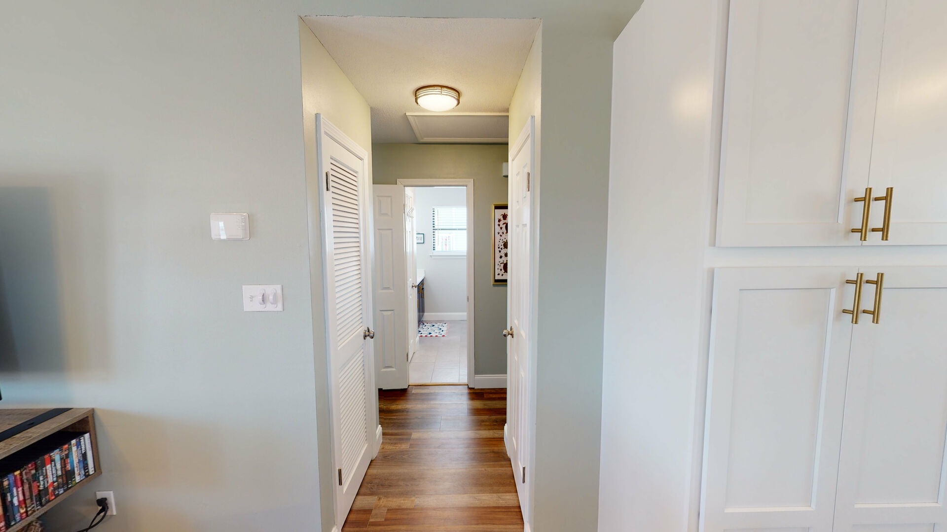 Hallway leading from the kitchen/living room into bedrooms 2,3, & hall bath.