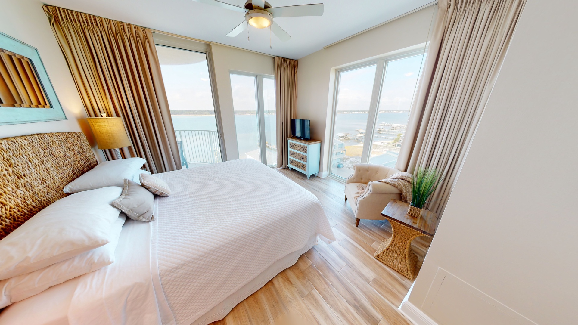 Bedroom 3 has a king bed, TV, water views and balcony access