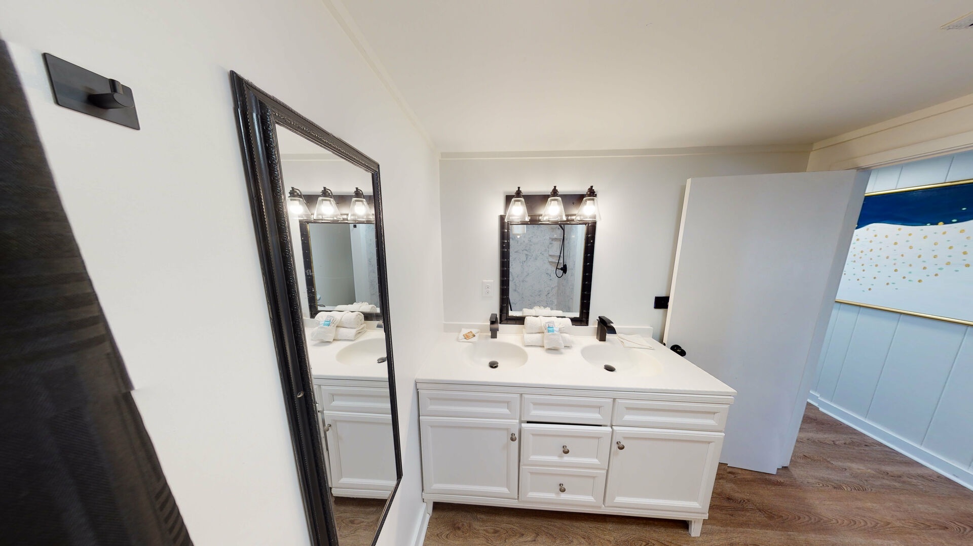 Shared hall bath with walk-in shower and double vanity