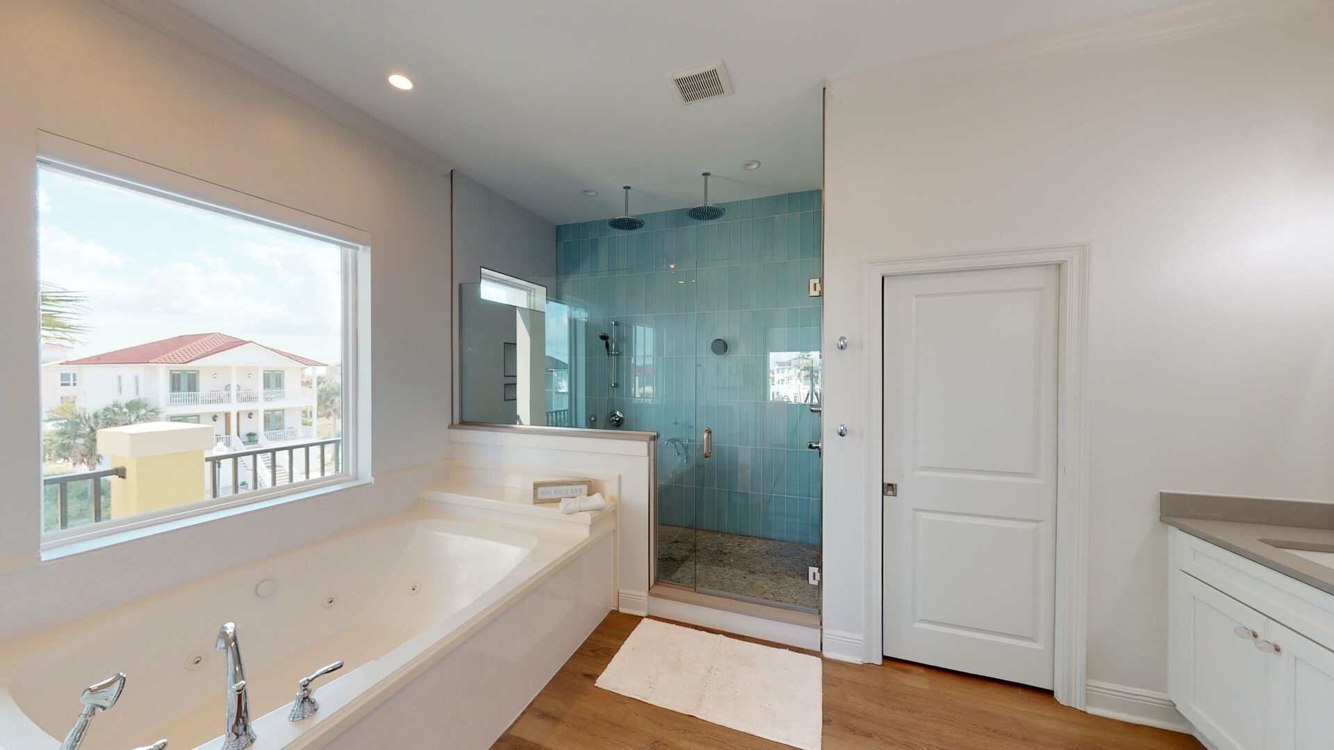 Large master shower with a soaking tub