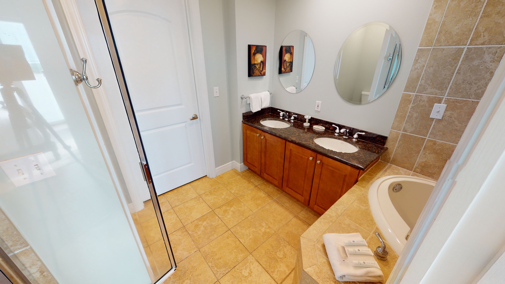 The bathroom in bedroom 2 has a double vanity and a walk-in shower