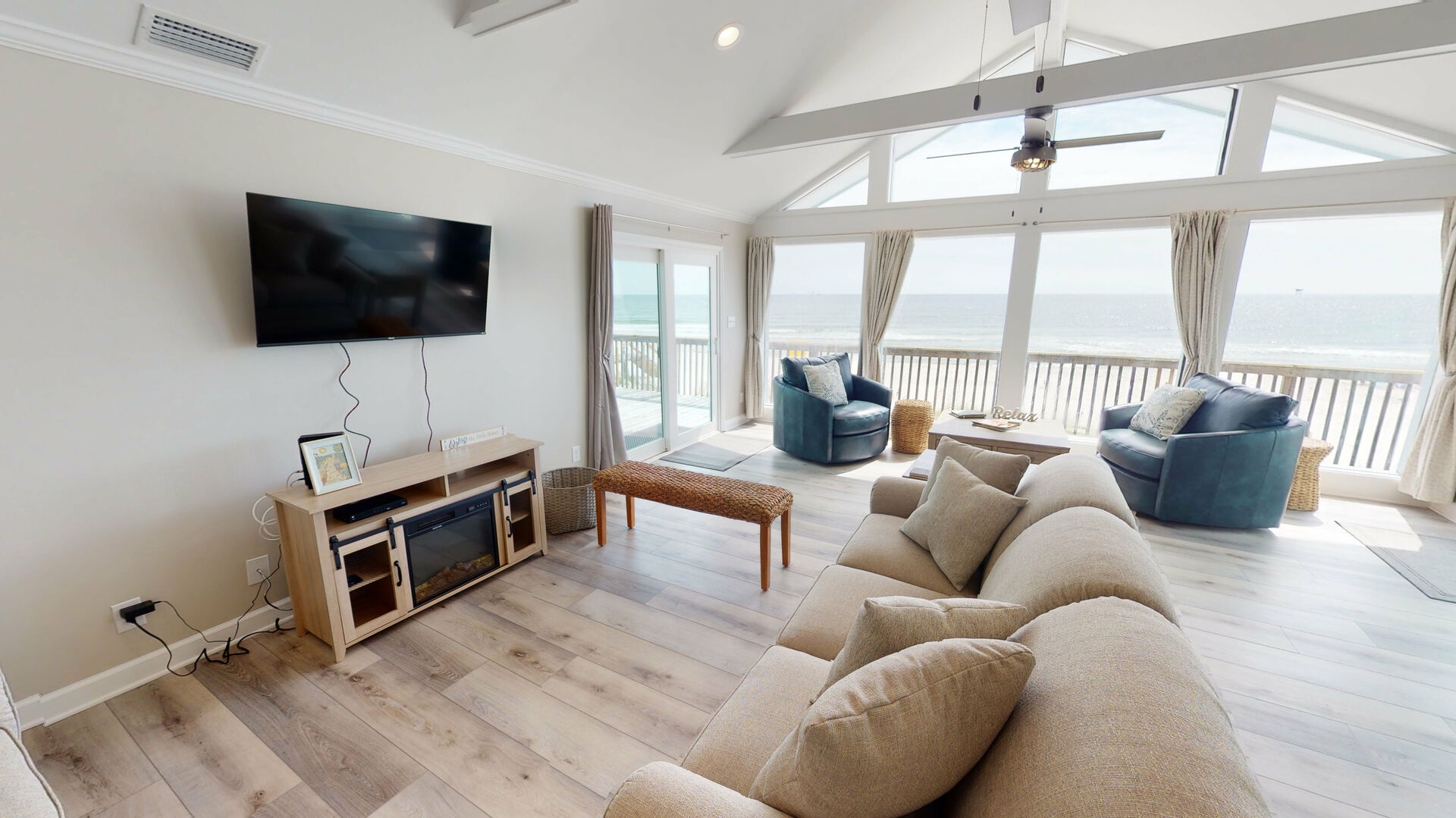 Don't worry, you can still see the Gulf and the TV in this spacious living area