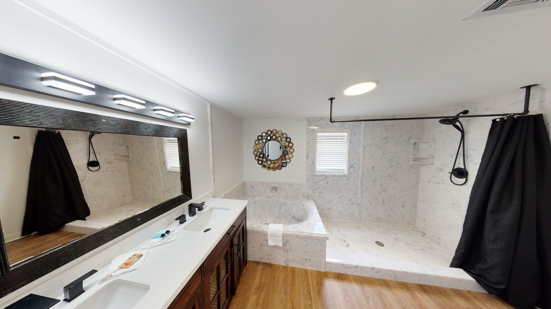 Master bath with double vanity, jacuzzi tub and walkin shower