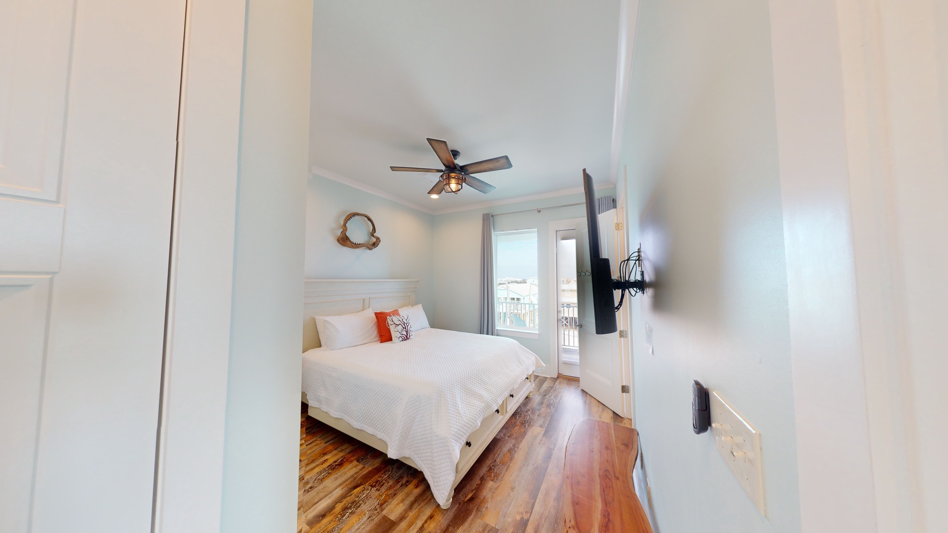 Spacious Master bedroom with a king bed, TV, balcony access and a private bathroo