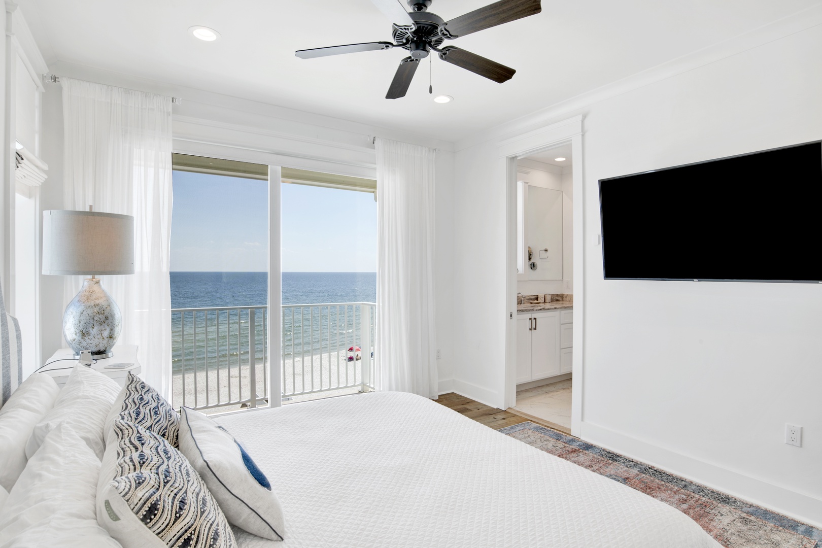 Bedroom 5 features Gulf views, private balcony, TV and a private bathroom