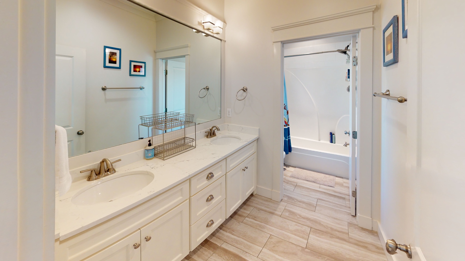 Shared hall bathroom on the 2nd floor with a double vanity and tub/shower combo