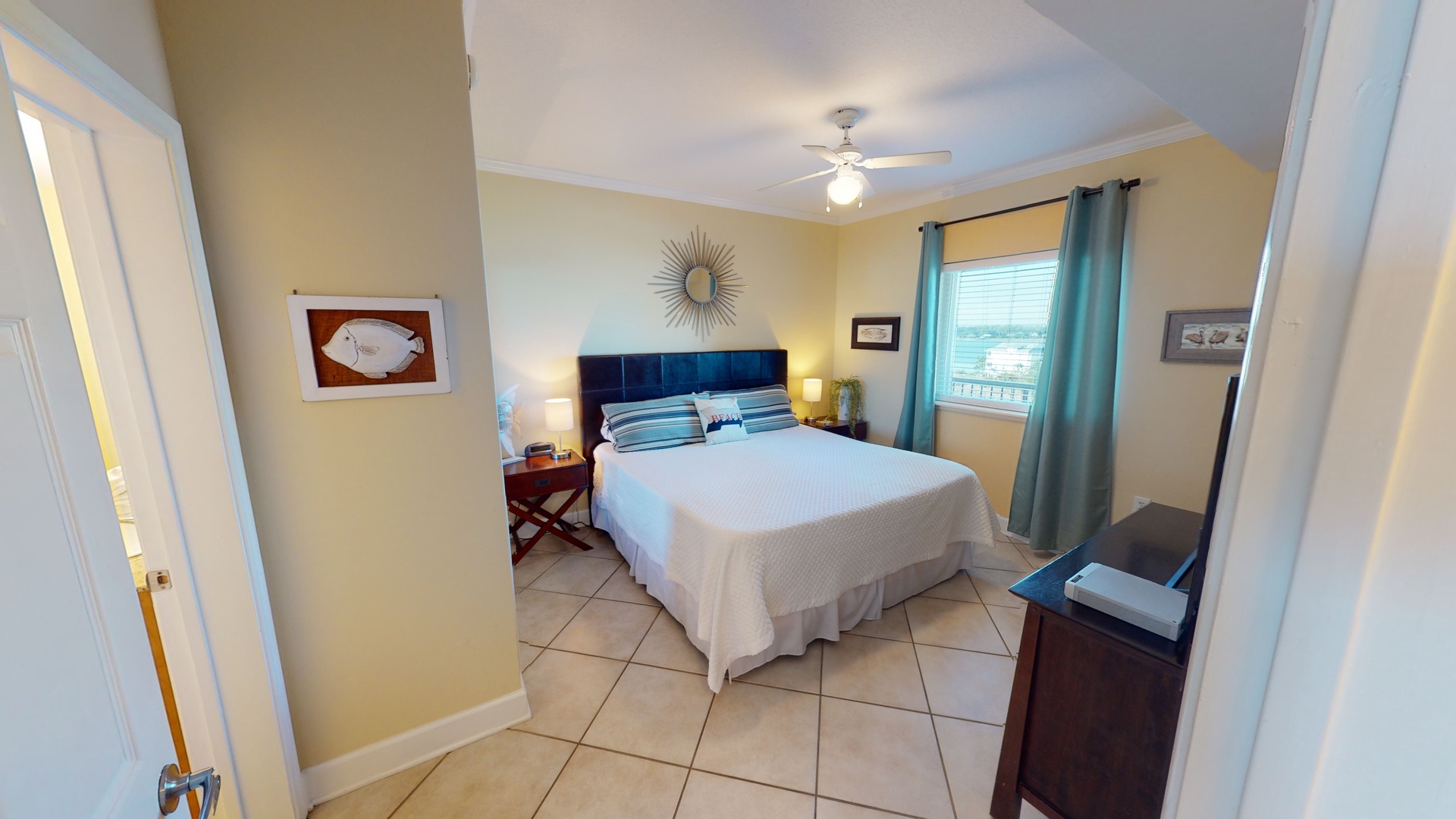The master bedroom features a king bed, TV and a private bathroom