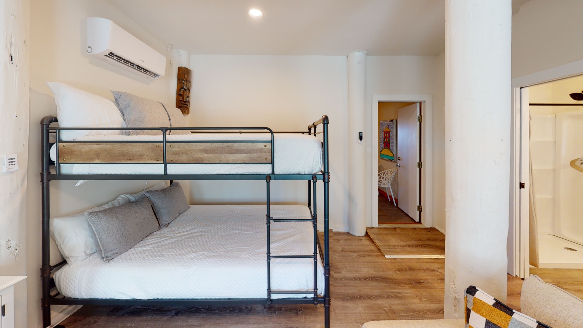 This bedroom sleeps 4 in a queen over queen bunk bed