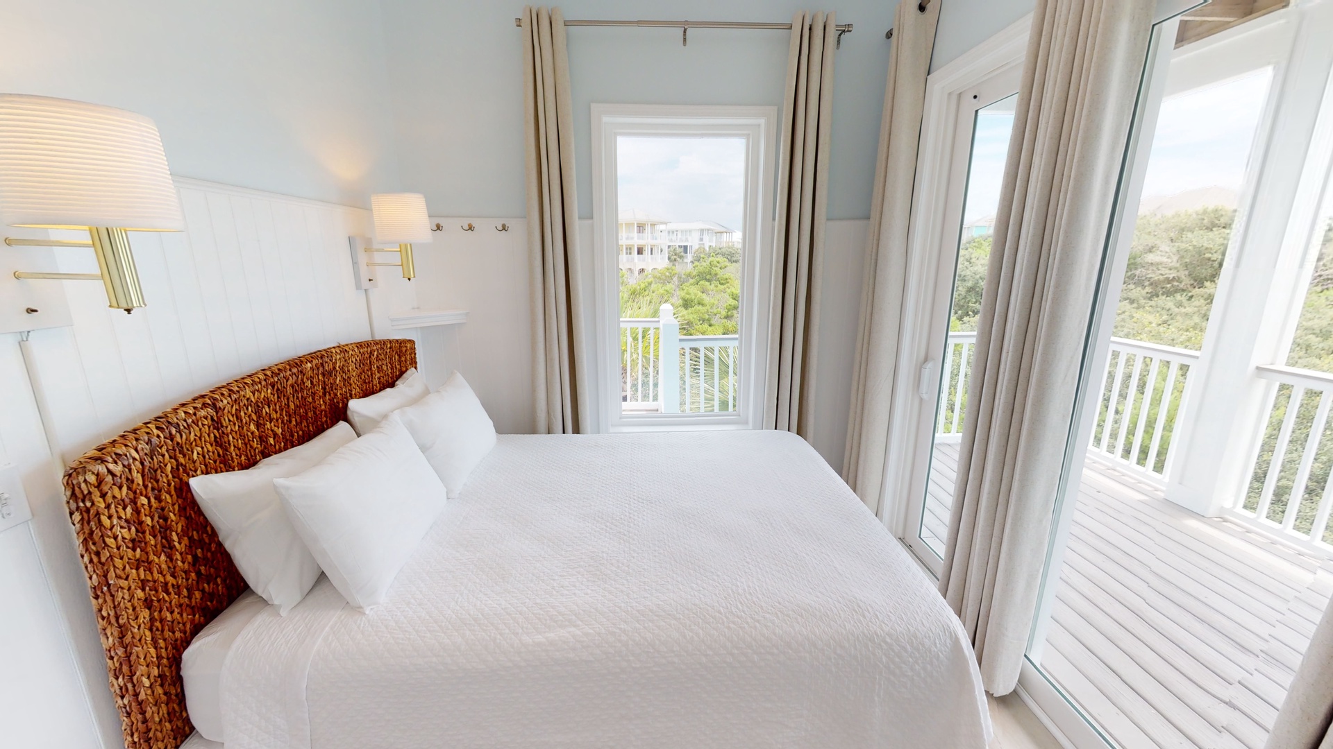 Little-Blue-Bedroom 2 is on the 2nd floor with a queen bed, TV, ceiling fan and balcony access
