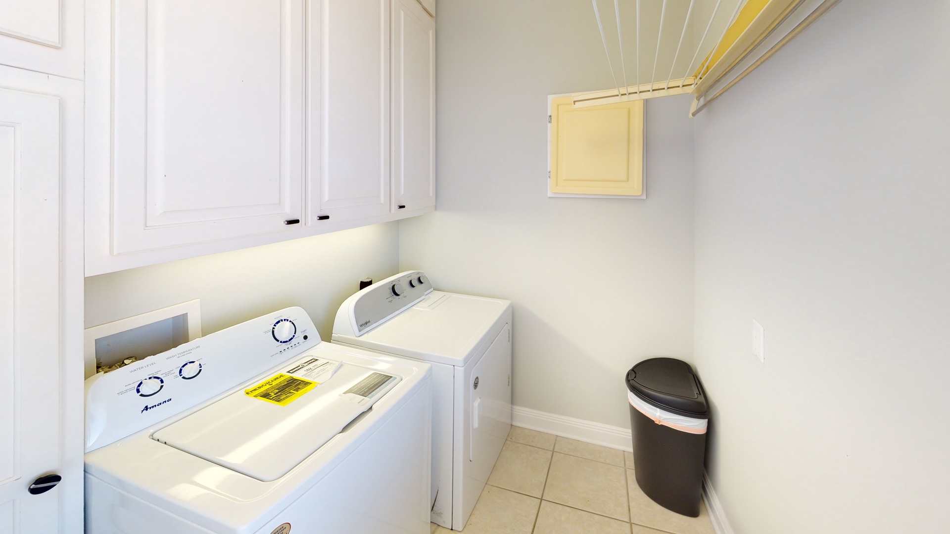 Large laundry room with full size washer and dryer