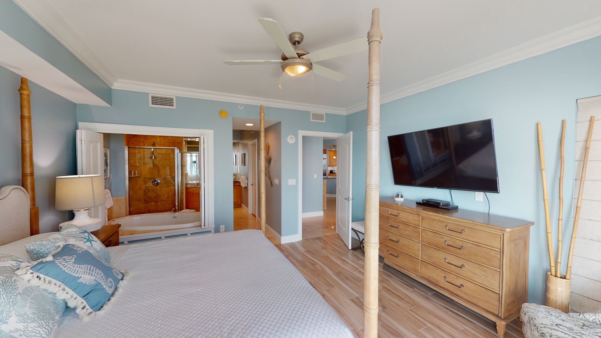 Master bedroom features large TV and master bath