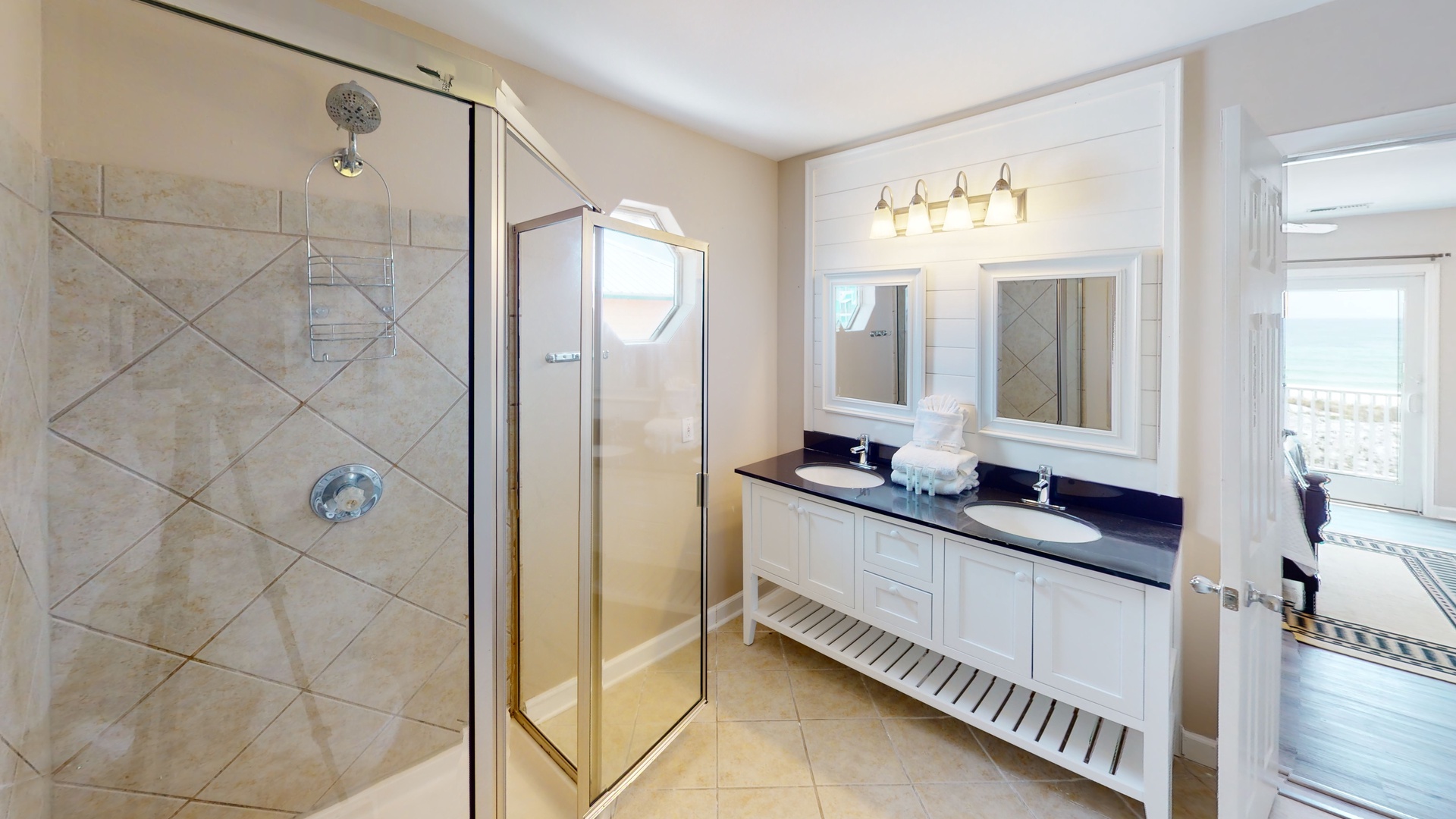 This 2nd floor bathroom has an entrance from bedroom 3 and the hall- it features a walk-in shower and a double vanity