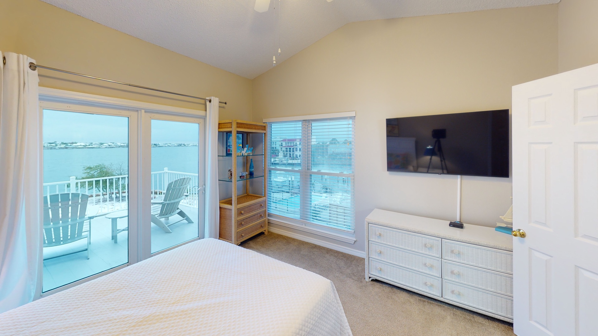 Bedroom 2 features a TV, water views and private balcony access